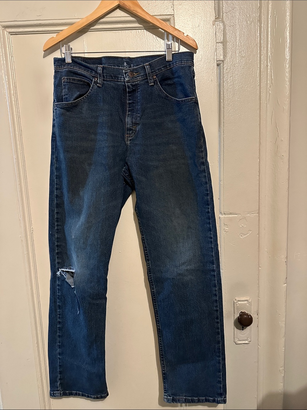 Vintage Wrangler Men's Dark Blue Straight Jeans with distressing. Size 32 x 32